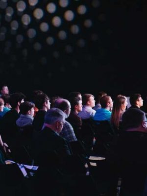 Event-Videographer-London-Audience-taking-notes-370x550